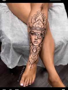 a woman's leg with a tattoo on it