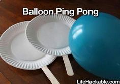 paper plates, popsicle sticks, and a balloon are all you need to play balloon ping - pong