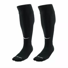 two pairs of black socks with white nike logo on the bottom and one pair is shown