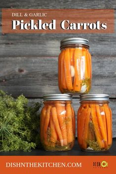 three jars filled with pickled carrots on top of a table