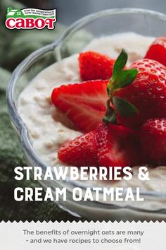 strawberries and cream oatmeal in a glass bowl with green leaves on top