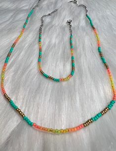 These lovely dark Turqouise Beadwork sets come with a matching necklace, Bracelet, and earrings in a deep sunset pallete. These make an excellent gift & can be resized with notice beforehand! Adjustable Turquoise Beaded Necklaces, Adjustable Turquoise Beaded Necklace, Turquoise Jewelry With Spacer Beads For Summer, Turquoise Beads For Jewelry Making In Summer, Adjustable Turquoise Colorful Beads, Adjustable Turquoise Beaded Chain, Summer Turquoise Jewelry With Colorful Beads, Turquoise Faceted Beads Jewelry For Summer, Turquoise Jewelry With Faceted Beads For Summer