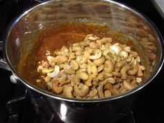 the food is being cooked in the pot on the stove