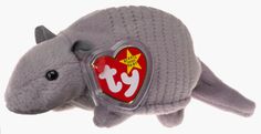 a gray stuffed animal with a heart shaped tag