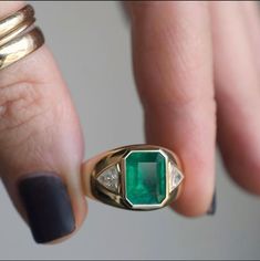 Emeralds are one of nature’s masterpieces—known as “The Jewel of Kings” this gem has been long regarded as a superior stone throughout the ages. Our impressive emerald is framed by just the right amount of sparkle and set in buttery warm gold that glows on wearers hand, making it the perfect statement piece for every body. 3.21 ct Zambian Emerald .60 tcw trillion diamonds 14k yellow gold Band measures 5mm, tapers to 13.4mm face Size 7, sizable Made by Private Label for Good Fortune in Los Angele Timeless Emerald Jewelry For Formal Occasions, Classic Emerald Jewelry With Baguette Cut, Elegant Gold Gemstones Gia Certified, Elegant Gia Certified Gold Gemstones, Timeless Formal Emerald Jewelry, Classic Yellow Gold Diamond Gemstones, Timeless Emerald Jewelry With Brilliant Cut, Timeless Brilliant Cut Emerald Jewelry, Elegant Gold Gia Certified Gemstones