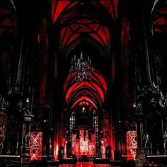 a gothic cathedral with red lighting and chandeliers