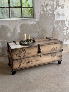 an old trunk with candles on top