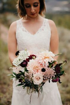 a woman holding a bouquet of flowers on her wedding day with the caption instagram