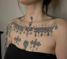 a woman with a tattoo on her chest