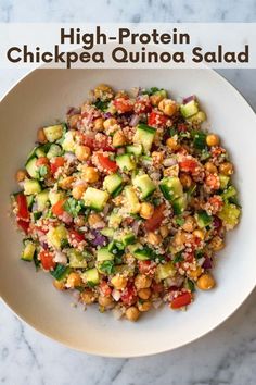 a white bowl filled with chickpea quinoa salad