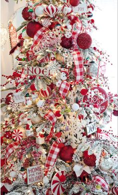 a christmas tree decorated with red and white ornaments