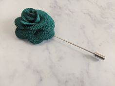 Upgrade your wardrobe in style with this stunning green flower lapel pin. Perfect gift for him, this unique high quality accessory will elevate any suit lapel or jacket. Elegant Green Pins For Gifts, Elegant Green Lapel Pin For Wedding, Elegant Green Wedding Lapel Pin, Vintage Flower Lapel Pin For Gift, Blue Flower Lapel Pin For Gift, Vintage Flower Lapel Pin Gift, Elegant Green Brooches With Handmade Flowers, Green Flower Brooch Pins, Elegant Green Flower Brooches