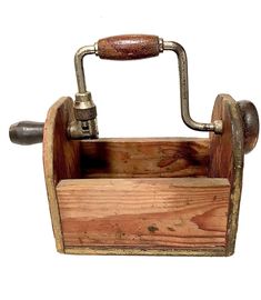 an old fashioned wooden tool holder with a wrench on it's end and handle