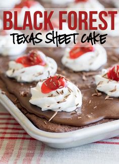 black forest texas sheet cake with chocolate frosting and cherries on top in a baking pan