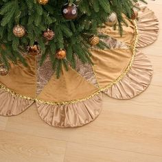 a christmas tree skirt with ornaments on it