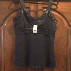 Express Design Studio Black Cami Size L Silk Overlay With Satin Trim And Ruffle Accents Hidden Side Zipper New With Tag Fitted Black Night Tops, Fitted Black Top For Night, Black Fitted Top For Night, Black Ruffle Cami Top, Black Ruffled Cami Top, Black Ruffled Camisole Top, Black Ruffle Camisole Top, Black Ruffled Camisole For Party, Chic Black Ruffled Camisole