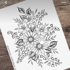 a drawing of flowers and leaves on a piece of paper