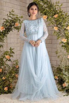 Ice blue floor length tulle gown with  beads , sequin and pearl hand embroidery. This beautiful gown is perfect for wedding, aniversary and formal functions  ✨This dress can be customise in any other colour and in all size, please contact us regarding any changes if you want.We will make this dress as per your choice. ✨We use high quality fabric and threads for embroidery.You won't face any problem in future regarding fading of colour or anything. You can use this outfit for many years.  ✨There may be slight colour difference due to high quality camera resolution and other filters. Rest every thing will be same.  🌸Care Instructions Dry clean only Princess Style Bridesmaid Ball Gown Wedding Dress, Organza Gown With Sheer Bodice In Maxi Length, Organza Maxi Gown With Sheer Bodice, Sheer Bodice Organza Gown In Maxi Length, Princess Style Floor-length Bridesmaid Gown, Floor-length Tulle Wedding Dress With Sheer Bodice, Elegant Tulle Maxi Dress For Wedding, Bridesmaid Gown With Sheer Tulle Bodice, Prom Dresses With Intricate Embroidery On Tulle