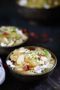 two bowls filled with food on top of a table