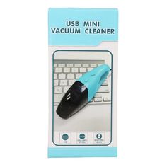 a blue and black usb mini vacuum cleaner in front of a white keyboard on a card