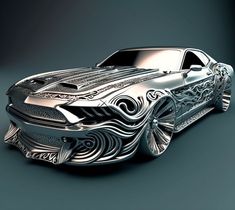 a silver car with intricate designs on the hood