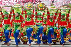 a large group of people in colorful costumes