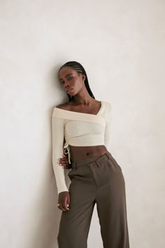 The perfect versatile styling piece! The Chelsie Top is made from a soft ribbed knit fabric in a neutral creamy hue. It features an asymmetric neckline with one off-shoulder, folded panel across neckline and sleeve, full length fitted sleeves and an adjustable draw detail at side waist. Pair with jeans or dress it up with a skort! Designed exclusively by Sabo.*THIS IS A FINAL SALE ITEM and cannot be returned. See our Returns Policy here Chic Ribbed Stretch Off-shoulder Top, Chic Stretch Ribbed Off-shoulder Top, Chic One-shoulder Knit Top For Spring, Spring Beige Top With Asymmetrical Neckline, Chic Fitted One-shoulder Knit Top, One Shoulder Knit Top For Spring, Chic One-shoulder Fitted Knit Top, Chic Beige Top With Asymmetrical Neckline, Fitted One Shoulder Knit Top For Spring