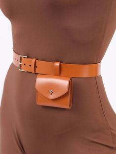 Made in a modern and minimalist aesthetic, the Micro Belt Bag is not only a fashion accessory but also a functional one. Although small, the stylish bag can hold your keys, coins or other small items. With its versatile design, the leather belt bag can be worn with a sporty jumpsuit for an edgy outfit or with a blazer for a chic, elegant look. Bag Size: Height- 7 cm, Width- 8 cm, Depth – 1.5 cm Waist belt width: 3 cm Adjustable using the front buckle Designed to be fitted on the waist Paraprofessional Outfits, Belt Bag Outfit, Waist Bag Leather, How To Make Leather, Leather Waist Bag, Gifts For Girlfriend, Christmas Gifts For Girlfriend, Leather Belt Bag, Brown Leather Belt