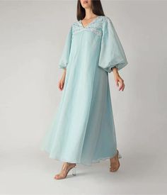 Featuring an Light Blue Kaftan with zardosi, cutdana, resham, sequins,dabka embroidery, floral butti & scallop motif embellishment & gota work as required For collection visit --  https://www.indberry.com This product will be shipped to you after 1-2 weeks from the date of order placed. All custom made orders are not returnable. Pls contact for Size chart and for other more colors Request You :To provide contact details for courier services. {VARIATION MAY COME ,IF ANY LACES OR GOTTA PATI or TUSSELS IS USED } NOTE:  1) Visual Samples on website may differ slightly from actual product due to light & effects during photography (Length & Breadth have 1 n 1.5 inches +/-). 2) Before placing order ,pls confirm product n color availability and  For Wholesale Order MOQ is 5 Pieces of any color/Pat Long Sleeve Dresses In Tissue Silk With Resham Embroidery, Elegant Designer Chanderi Embroidered Dress, Elegant Kaftan With Floral Embroidery For Festive Occasions, Party Kaftan With Dabka Work On Chanderi Fabric, Party Kaftan In Chanderi With Dabka Work, Party Kaftan With Dabka Work In Chanderi, Silk Embroidered Dress With Resham For Eid, Bollywood Style Tissue Silk Dress With Floral Embroidery, Elegant Chikankari Embroidered Dress For Reception