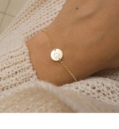 "Dainty initial bracelet ♡ Elegant and minimal, choose your initial and font at checkout! Perfect for everyday look and as a gift for your favorite person! Wonderful gift for your bridesmaids! This Listing is for ONE INITIAL BRACELET ♡ MATERIALS * Comes in Sterling Silver and Gold Filled. * Delicate high quality chain, jump rings and clasp. * Dainty disc 9.5 mm with a shiny finish. LENGTH * Comes in one size: 6.25\"+1. 25\" extender = 7.5\" total length. * Fits most wrists, if you need a bigger Dainty Adjustable Round Disc Jewelry, Engraved Minimalist Bracelets, Minimalist Engraved Round Bracelets, Simple Engraved Adjustable Jewelry, Simple Adjustable Engraved Jewelry, Adjustable Everyday Round Disc Jewelry, Everyday Round Bracelets With Initials, Minimalist Round Bracelet With Adjustable Length, Minimalist Adjustable Jewelry With Engraving Option