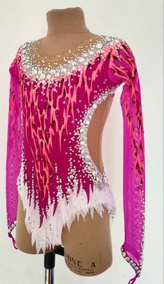 a pink and white top with sequins on it