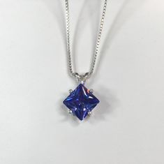 "Beautiful Trillion Tanzanite* & Sterling Silver Pendant Necklace * 2ct Princess Cut Tanzanite* measures 8mm * Solid Sterling Silver * 16\" or 18\" Sterling Silver Chain included-select your length Hallmarked & Gift Ready! Matching Ring available here https://www.etsy.com/listing/511156028/gorgeous-25ct-princess-cut-tanzanite Matching Earrings Also Available! *Tanzanite is one of very few gemstones that cannot be grown in a Lab, however, these Laboratory Grown Simulate Stones are optical Tanzanite Pendant, Tanzanite Necklace, Tanzanite Jewelry, Matching Ring, Fine Art Jewelry, Red Necklace, Brighton Jewelry, Handmade Jewelry Gift, Sterling Silver Necklace Pendants