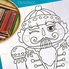 an image of a coloring book with pencils and crayons next to it