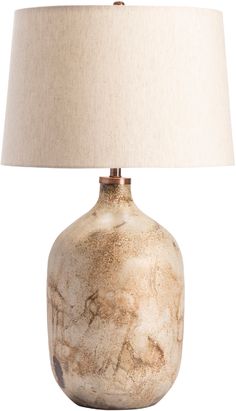 a table lamp with a white shade on it's base and a light brown drum