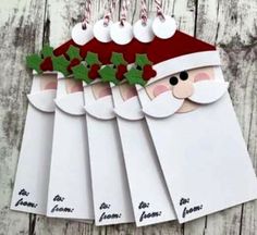 santa's face is on top of six christmas cards with candy canes hanging from them