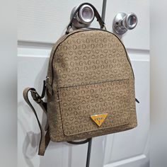 Brand New (Never Used) Beige Original Guess Backpack! Signature Guess Print In Beige And Brown. Medium Size Backpack With Plenty Of Space On The Inside, Multiple Pockets, And An Additional Pocket On The Outside. Silver Metal Pieces. Guess Backpack, Small Backpack Purse, Monogram Backpack, Mini Backpack Purse, Brown Backpacks, Guess Purses, Quilted Backpack, Black Leather Backpack, Guess Bags