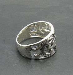 Sterling silver ring 925/1000, flower. Stamped 925.Approximate weight 6.0 grams. Top width 1.9 cm (0.76 inches). All our jewels are made from solid sterling silver 925/1000 and are carefully crafted by hand in our family workshop. We dispatch your orders in 5 working days, worldwide and the postage is $5. We ship registered priority mail. Please allow 5-7 working days for delivery in Europe and 10-15 working days outside Europe. For any questions - please do not hesitate to contact me! Classic Silver Hallmarked Flower Ring, Formal Silver Open Ring With Flower Design, Formal Silver Flower Open Ring, Elegant Silver Engraved Wide Band Ring, Elegant Engraved Silver Wide Band Ring, Elegant Sterling Silver Engraved Flower Ring, Classic Silver Flower Ring Stamped 925, Formal Flower Shaped Rings Stamped 925, Classic Sterling Silver Flower Ring For Formal Occasions