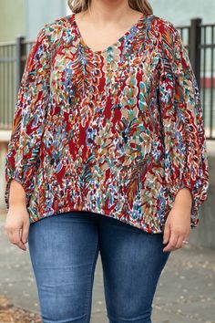 Everyone will love this trendy new top! This top has a fun floral print with warm colors you can style for every occasion! It's comfortable for all day wear, has a figure-flattering fit, and features the cutest balloon sleeves! Simply pair this top with skinnies and booties for an effortlessly chic look! 95% Polyester, 5% Spandex Chic Multicolor Tops With Balloon Sleeves, Floral Print Patterned Tops For Fall, Patterned Floral Print Tops For Fall, Red Tops With Vibrant Print For Fall, Casual Abstract Print Blouse For Fall, Casual Blouse With Abstract Print For Fall, Multicolor Floral Print Tops For Fall, Chic Floral Print Puff Sleeve Top For Fall, Chic Multicolor Print Blouse For Fall