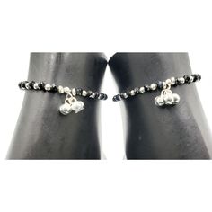 "Description 925 Sterling Silver Stretchable Black Bead Anklet (92.5% Silver purity) available in four lengths from from 4.5 inch (0-12 month) ,5.5 inch (1-3 Years) 6.5 inch (4-9 Years) & 7.5 inch (10-12 Years)and suitable for daily use. Makes low bell / charms sound \"chann-chann-chann\", weaved with NYLON Flexible elastic WIRES and stretchable . SOLD IN PAIRS. Dimensions Anklet Weight: ~8.0-12.0 grams / pair. 1 Pair 4.5-inch + 0.5 inch (nylon stretchable Extension) Anklet: ~8.0-9.0 grams ( Adjustable Black Anklet With Tiny Beads, Black Anklets With Round Beads For Gift, Traditional Black Beaded Bracelets With Tiny Beads, Elegant Black Beaded Anklets, Bead Anklet, Bell Sound, Beautiful Anklet, Chandler Az, Beaded Anklets