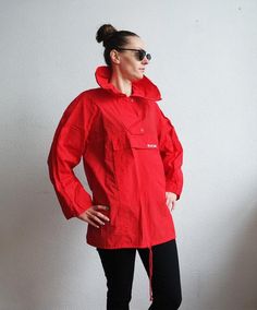 Vintage Red Jacket Rain Coat Waterproof Medium size Oversized WindbreakerBottom line - adjustableLabel size: feels like M/L Measurements (taken while lying flat):Chest:56cm/22"Sleeve plus shoulder: 69cm/27"Lenght: 74cm/29"Collar height: 17cm/7"Condition: Good Vintage ConditionPlease check measurements to insure a proper fit. Remember to allow yourself some extra room for movement. You can compare these with something from your closet that fits you well.SHIPPING* I ship worldwide via Priority mai Red Windbreaker With Pockets For Outdoor Activities, Functional Red Outerwear For Fall, Red Windbreaker For Spring Outdoor Activities, Red Outerwear With Adjustable Hood For Spring, Red Spring Windbreaker For Outdoor Activities, Red Windbreaker For Outdoor Activities In Spring, Red Hooded Raincoat For Fall, Red Spring Outerwear With Adjustable Hood, Red Windbreaker For Spring Outdoors