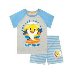 Boys Baby Shark Short Pajamas. Sing the Baby Shark song with your little shark at bedtime with these cute Baby Shark PJs and they'll have the snappiest dreams! The grey pajama top has contrasting blue short sleeves and features a colorful print of Baby Shark on a surf board with the slogans 'Ruling The Sea' and 'Baby Shark'. Paired with blue and grey striped pj shorts with an elasticated waistband and a small print of Baby Shark with the words 'Making A Splash!'. Your snappy dresser will love to Shark Merchandise, Kids Pajamas Boys, Shark Pajamas, Baby Shark Song, Shark Girl, Short Pajamas, Cute Pajama Sets, Cute Pajamas, Kids Clothes Boys