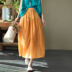 Gender: Women Item Type: Long Skirt Material: 70% Linen 30% Cotton Season: Summer Style: Casual, Loose Waist Type: Natural & Elastic Waist One Size Length: 86 cm/ 20.08 " Waist: 66- 102 cm/ 27.56- 39.37 " Baggy Spring Midi Skirt, Spring Baggy Lined Maxi Skirt, Spring Baggy Gathered Skirt, Orange Flared Skirt For Spring, Baggy Maxi Skirt For Summer, Spring Orange Pleated Skirt, Orange Pleated Skirt For Spring, Non-stretch Yellow Skirt For Summer, Relaxed Fit Solid Maxi Skirt