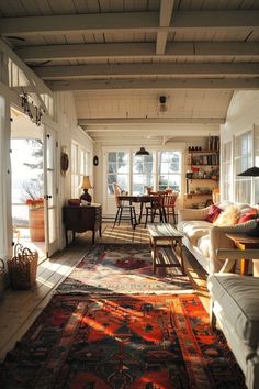 a living room filled with furniture and lots of windows