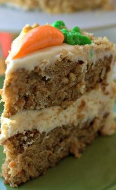 a slice of carrot cake on a green plate