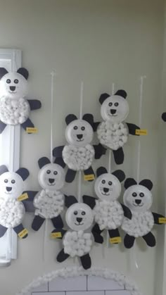 there are many panda decorations hanging on the wall