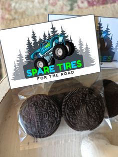 two oreos are sitting in a package with a sign that says spare tires for the road