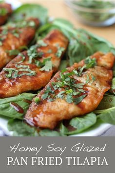 the plate has chicken wings on it and garnished with cilantro leaves