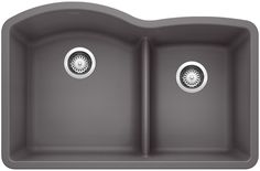 the double bowl kitchen sink has two faucets on one side and an under - mount drain