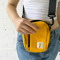 Our new "Daisy" crossbody bag is the perfect everyday accessory. Made from high-quality 16oz washed yellow canvas, this durable bag features an adjustable shoulder strap and multiple compartments to keep all you bits and bobs in-check."Daisy"Retro Inspired Great giftYour new favorite accessory Durable 16oz Washed Yellow CanvasAdjustable Shoulder StrapMultiple Compartments7” X 5” X 2.25”Quick Ship Casual Yellow Shoulder Bag With Zipper Closure, Yellow Shoulder Bag With Zipper Pocket For Everyday Use, Trendy Yellow Canvas Bag With Adjustable Strap, Trendy Yellow Canvas Shoulder Bag, Yellow Pouch Bag With Zipper Pocket, Yellow Bag With Zipper Pocket For Everyday, Casual Yellow Canvas Bag For Everyday Use, Yellow Canvas Bag With Pockets, Yellow Everyday Pouch Shoulder Bag