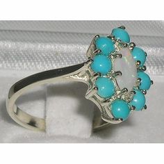 *This floral design ring is made from14K White Gold and handset with Natural Opal & Turquoise. The centre opal is Marquise cut and measures 8x4mm (0.32"x0.16" inches) Opal and is surrounded by eight 3mm (0.12" inches) Turquoise gemstonesHandcrafted from 14K White Gold and hallmarked by the London Assay Office which confirms the rings authenticity. The Hallmark includes the 585 purity mark for 14K gold  All the Gemstones are Genuine Natural & Ethically SourcedPLEASE INCLUDE YOUR TELEPHONE Elegant Adjustable Turquoise Opal Ring, 14k White Gold Multi-stone Opal Ring, Unique Turquoise Multi-stone Opal Ring, Victorian Multi-stone Opal Ring, Toddler Hair Accessories, Vintage Multi-stone Turquoise Ring Gift, Turquoise Ring Engagement, Turquoise Gold Ring, Glitter Hair Bows